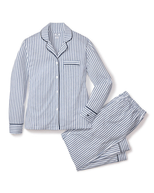 Striped pajama set on a white background | Lead