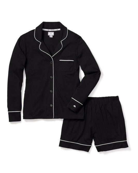Black pajama set with white piping on a white background | Lead