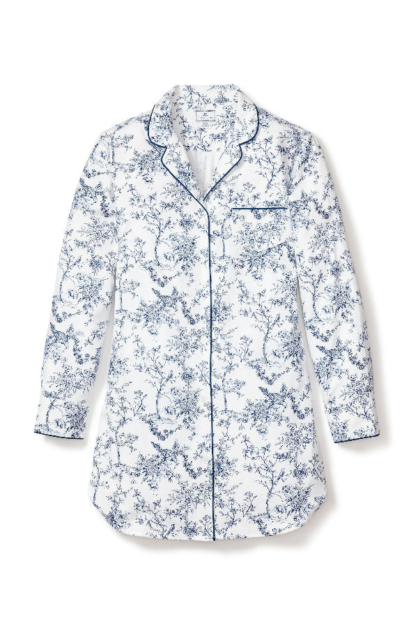 Woman wearing a floral pajama set against a plain background | Grid | Exclude