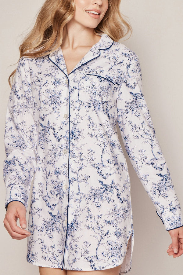 Woman wearing a floral patterned nightshirt against a plain background | Grid Hover | Exclude