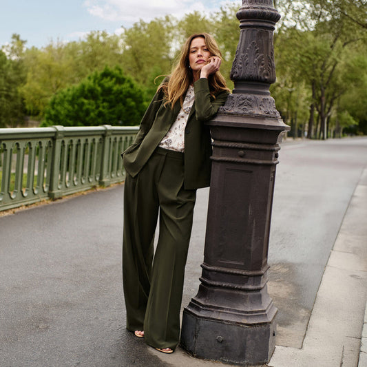 woman in green suiting. | Lead