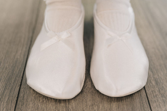 White satin padded slippers.