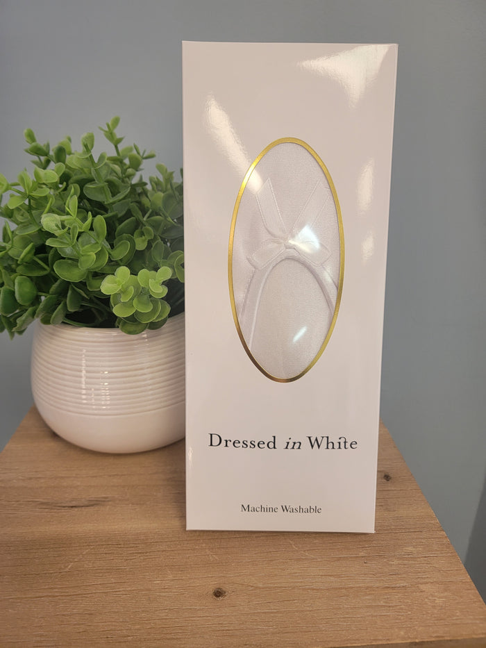White satin padded slippers in box.