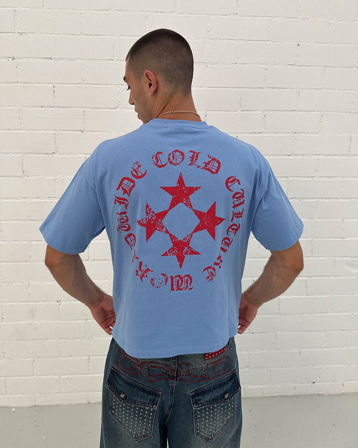 SCATTER TEE BLUE - blue graphic print tee, back view on male model - Cold Culture