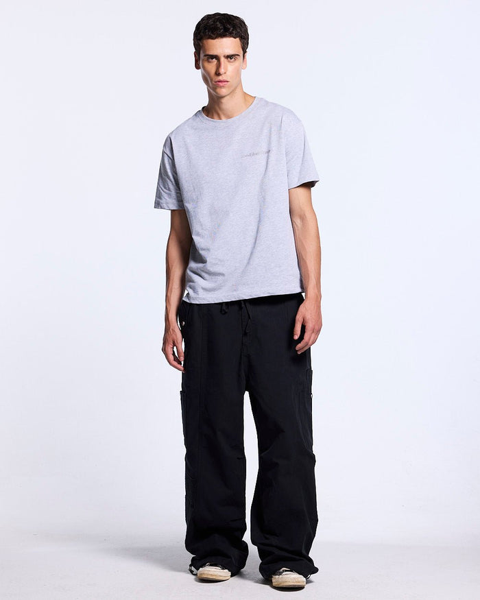 SOLID CARGO PANTS BLACK - black cargo pants, front view on male model - Cold Culture