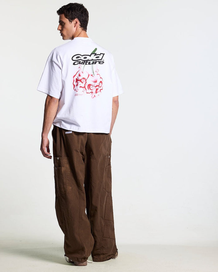 SOLID CARGO PANTS BROWN - brown cargo pants, back view on male model - Cold Culture