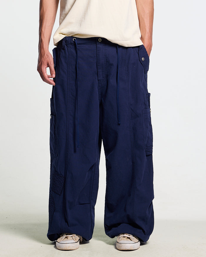 SOLID CARGO PANTS NAVY - navy cargo pants, front view on male model - Cold Culture