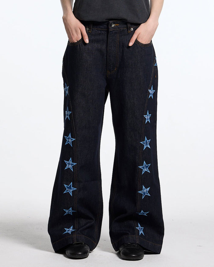 STARSHIP V3 PANTS RAW DENIM - raw denim pants with star print, front view on female model - Cold Culture #woman