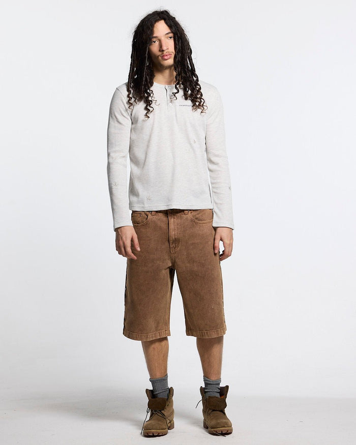 STUDS SHORT BROWN - brown studded denim shorts, front view on male model - Cold Culture