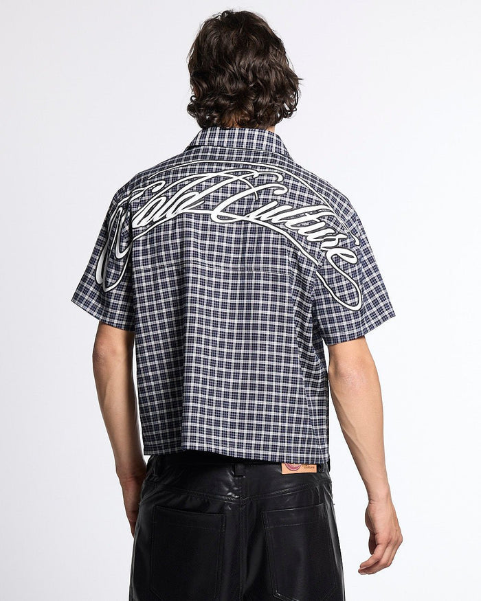 TARTAN SCRIPT SHIRT BLACK - black plaid short sleeve shirt, back view on male model - Cold Culture