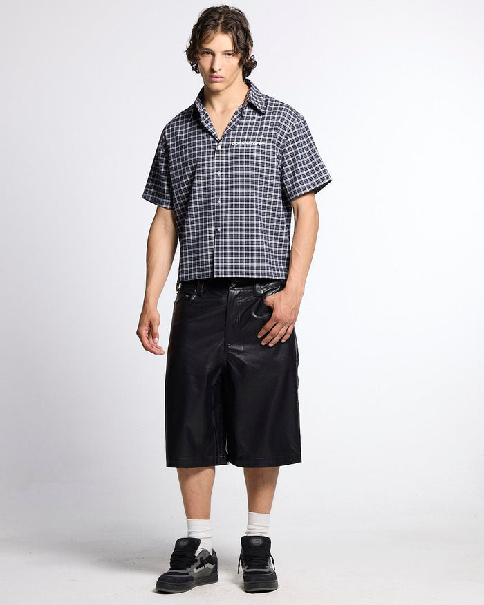 TARTAN SCRIPT SHIRT BLACK - black plaid short sleeve shirt, front view on male model - Cold Culture