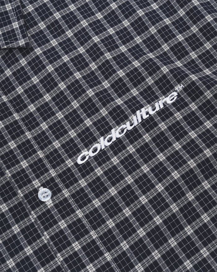 TARTAN SCRIPT SHIRT BLACK - black plaid short sleeve shirt, detail close-up - Cold Culture
