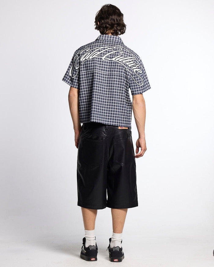 TARTAN SCRIPT SHIRT BLACK - black plaid short sleeve shirt, back view on male model - Cold Culture