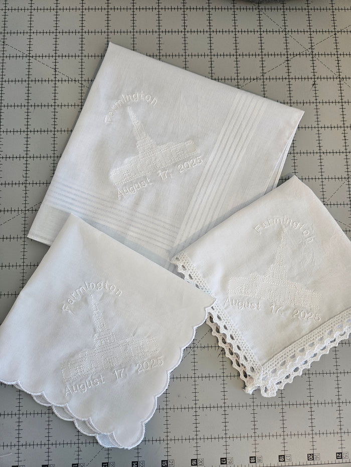 White hankies with embroidered Temples and dates.