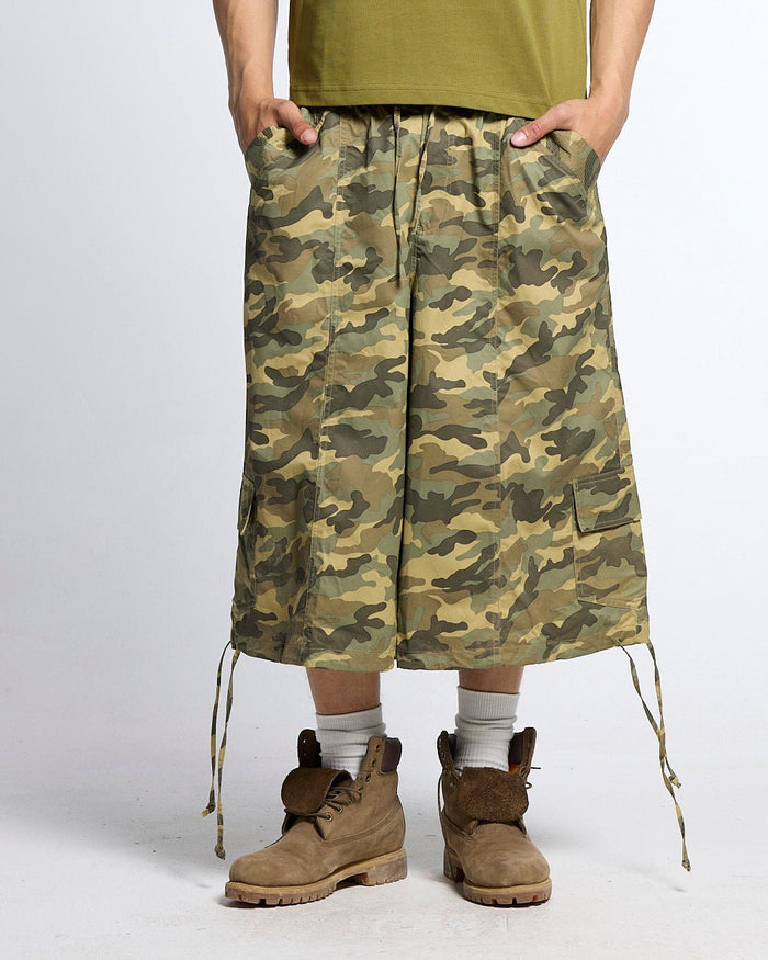 UTILITARY CAPRI PARACHUTE CAMO - camo cargo capri shorts, front view on male model - Cold Culture