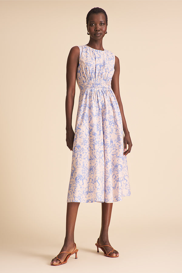 Woman wearing a floral dress on a beige background | Exclude | Grid