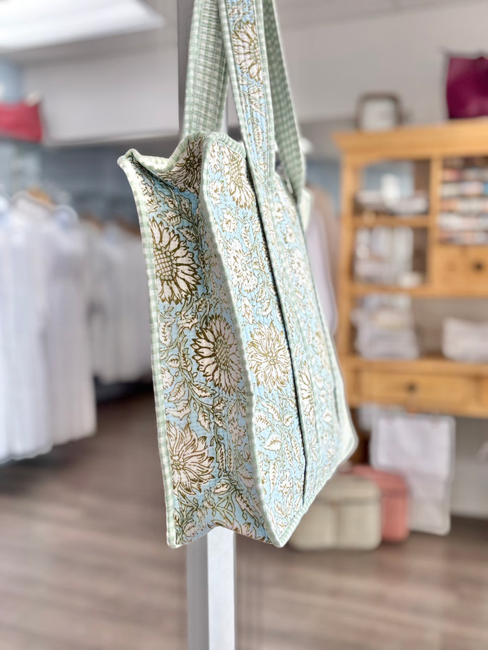 green and blue quilted bag