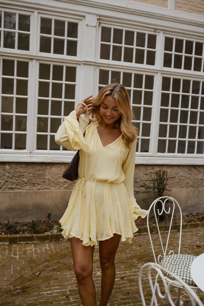Yellow Zora Dress with flared long sleeves and waist tie, full length view