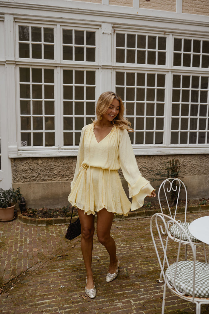 Yellow Zora Dress back view showing flowy silhouette